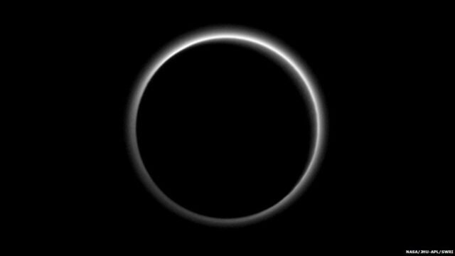 Pluto backlit by Sun
